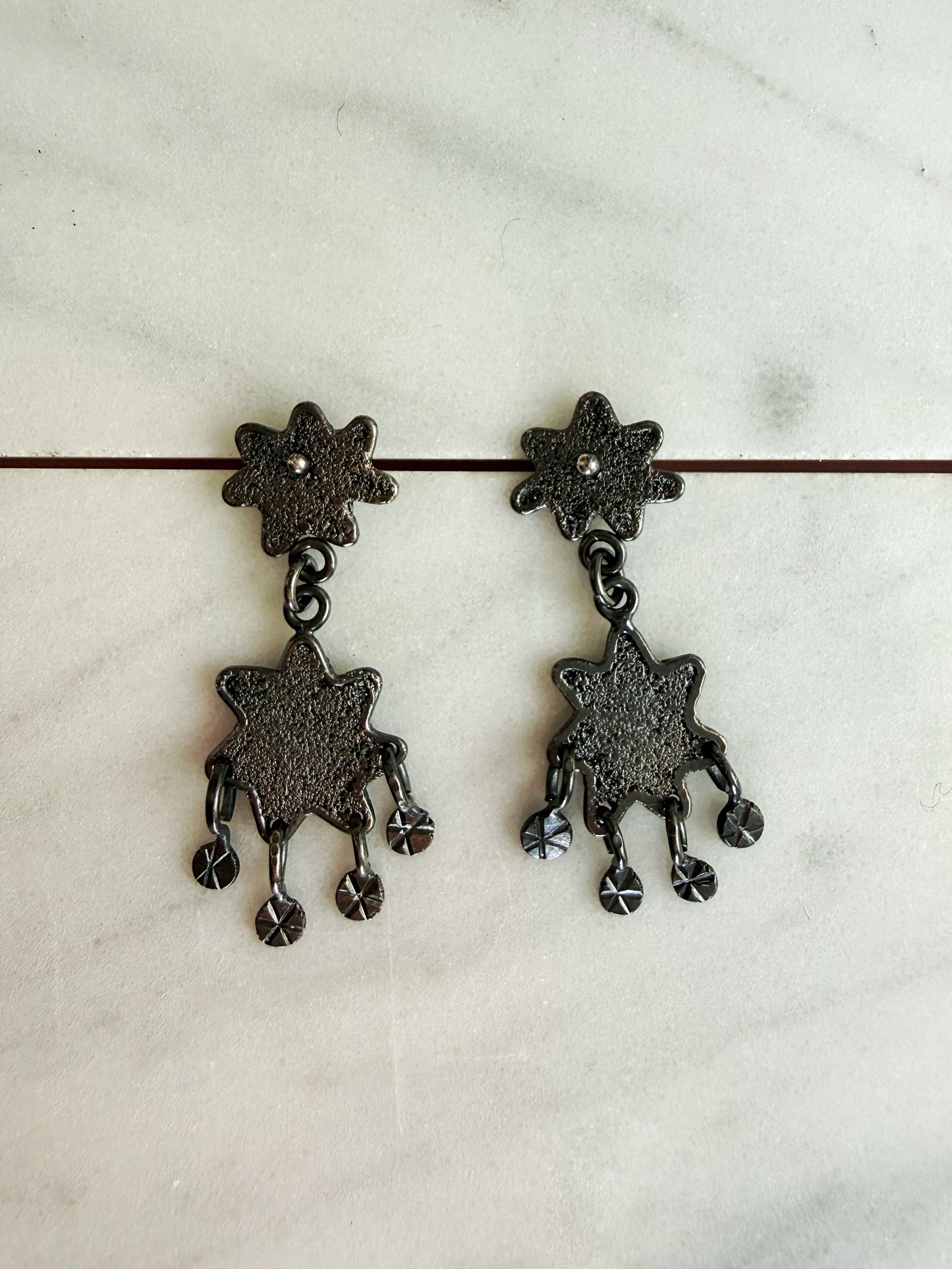 Dark Textured Star Chandelier Earrings