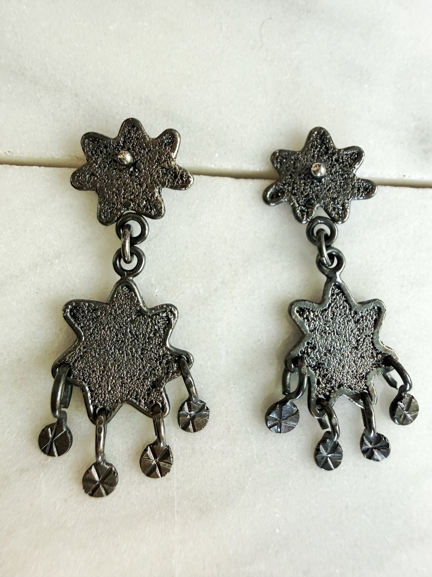 Dark Textured Star Chandelier Earrings